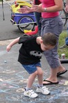 Jacob focuses all his energy on his game of hopscotch.