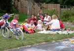 Next shift of friends picnicking on the lawn.