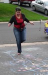 Rebecca joins the kid's game of hopscotch in 3-inch heels!  Oh-so Rebecca!  