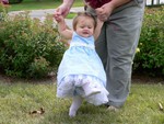 BIG steps!  She has to step that big to be able to see her feet from under her petticoat!