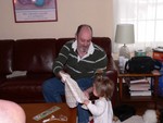 Sam gets some help opening a present from Daddy.  