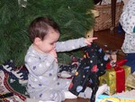 Of all the gifts that Zachary received, he liked his space pajamas the best. He admired them for five minutes straight!