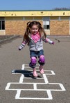 Hopscotch is one of Samantha's new outdoor favorites.  Ever since she learned how to hop on one foot, she's been unstoppable!