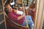 Oma and Sammi enjoy a gentle rocking on the cabin porch.