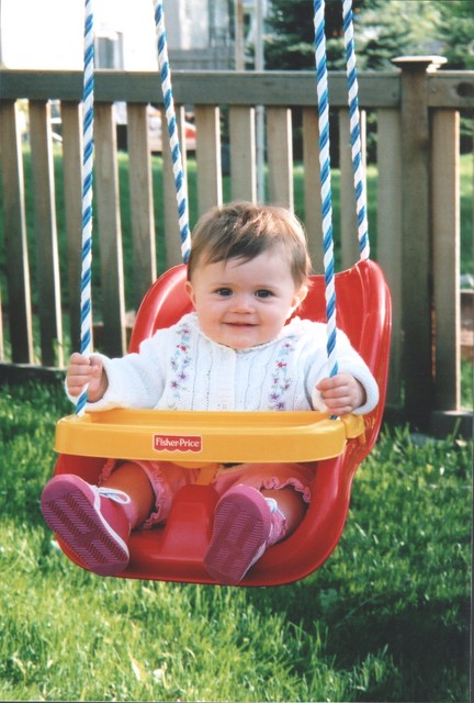 Samantha goes for a swing for the first time.  9 months.