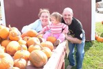 Despite her best efforts, the kind passerby could not get Samantha to look at the camera for this family shot.