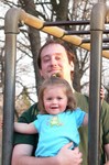 Uncle Aaron shows Sam the ropes on the monkey bars at the park.