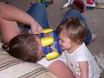 Samantha and Mommy play with her new drum in a rather innovative fashion.