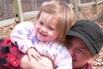 Samantha and Nana play in the woods of Bay's Mountain.