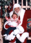 I don't know why parents ever think a baby is going to be fond of a huge man in a red suit and fluffy hat and gloves that they've never seen before. . . 